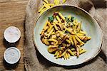 pasta penne with mushrooms grilled in sour cream sauce