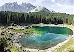 landscape and reflections in the famous lake of Carezza - Dolomites, Italy