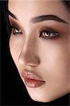 Asian woman with glamour eye make up close-up loking at the side. High resolution fashion concept