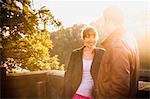 Young couple dating on bridge, Munich, Bavaria, Germany