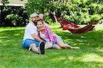 Family with two children having fun in the garden, Munich, Bavaria, Germany