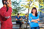 Young couple outdoors, people in background, Osijek, Croatia