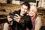 Young couple taking a self portrait outdoors