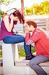 Young couple using digital tablet outdoors, Osijek, Croatia