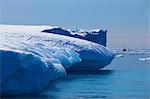 Fishing boat and iceberg, Arctic Ocean, Greenland