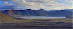 Glacial lake against mountain range, Landmannalaugar, Iceland