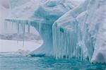 Wind and water sculpted iceberg with icicles at Booth Island, Antarctica, Polar Regions