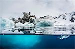 Above and below water view of iceberg at Booth Island, Antarctica, Polar Regions