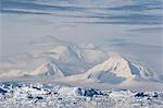 Snow-covered mountains line the ice floes in Penola Strait, Antarctica, Polar Regions