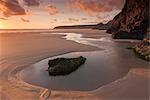 Tidal pools on Bedruthan Steps beach at sunset, Cornwall, England, United Kingdom, Europe