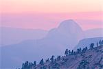 Half Dome at sunset, the mountain partially obscurred by smoke from the 2014 Dog Rock wildfire, Yosemite National Park, UNESCO World Heritage Site, California, United States of America, North America