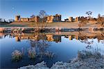 Early morning sunshine in winter illuminates Alnwick Castle in Northumberland, England, United Kingdom, Europe