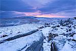 Sunrise above a snow covered moorland, Belstone Tor, Dartmoor National Park, Devon, England, United Kingdom, Europe