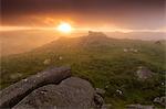 Misty summer sunset at Holwell Tor in Dartmoor National Park, Devon, England,United Kingdom, Europe