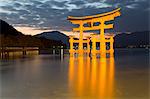 The floating Miyajima torii gate of Itsukushima Shrine at dusk, UNESCO World Heritage Site, Miyajima Island, Western Honshu, Japan, Asia