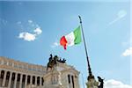 Italian flag at the Altare della Patria (Altar of the Fatherland) bronze statue, Monumento Nazionale a Vittorio Emanuele II (National Monument to Victor Emmanuel II) Piazza Venezia, Lazio, Rome, Italy