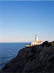 Lighthouse on Coastal Rock at Sunset, Majorca, Balearic Islands, Spain