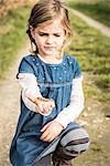 Girl holding worm in hand