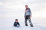 Father and son playing in snow