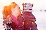 Woman with boy in her arms, close-up