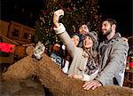 Friends taking selfie at Christmas Market