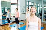 Female instructor with Pilates class