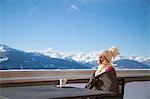 Beautiful woman day dreaming, Crans-Montana, Swiss Alps, Switzerland