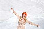 Happy beautiful woman enjoying in snow, Crans-Montana, Swiss Alps, Switzerland