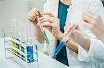 Lab worker working with test tubes