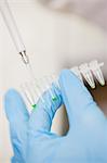 Scientist pipetting samples for testing