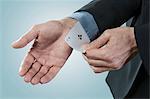Businessman pulling an ace from sleeve, Bavaria, Germany