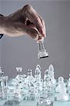 Close-up of man's hand going for checkmate while playing chess, Bavaria, Germany