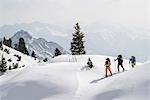 Ski mountaineers climbing on snowy mountain, Tyrol, Austria