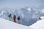 Ski tourers looking at mountains view, Tyrol, Austria