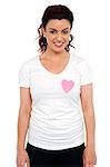 Woman with pink paper heart on her t-shirt. Love concept