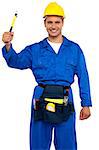 Smiling young repairman holding hammer with tool box wrapped around his waist