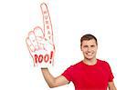 Handsome young smiling man holding a large foam hand showing cheering up his team