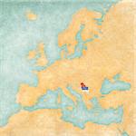 Serbia (Serbian flag) on the map of Europe. The Map is in vintage summer style and sunny mood. The map has soft grunge and vintage atmosphere, which acts as watercolor painting on old paper.