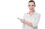 Businesswoman pointing towards copy space area