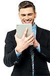 Smiling young manager browsing on tablet pc
