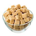 Brown sugar in a glass bowl isolated on a white background. Side view.