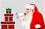 Santa Claus with megaphone and stack of gifts