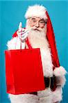 Santa distributing gifts for Christmas eve