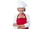 Mature woman chef keeping her arms crossed