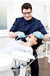 Female patient with dentist in a dental treatment