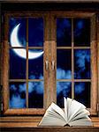 Open book on wooden windowsill