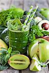 Green detox smoothie with raw vegetables and fruits