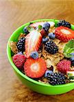 homemade granola muesli with berries (strawberries, raspberries, blueberries) for breakfast