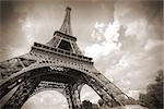 Paris, France - Eiffel Tower seen from Champ de Mars. UNESCO World Heritage Site. Sepia tone.