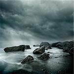 Dramatic Coastal Scene. Sea Storm Long Exposure, Rugged coast line and swirling waters.